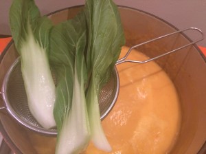 Pak choi steaming over soup