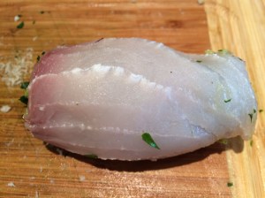 Swordfish roll being rolled