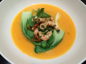 Pumpkin and coconut broth with spicy prawns
